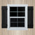 Window with black shutters on a wooden background Window with black shutters on a wooden background