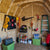 Interior of a storage shed with a tool wall, shelves, and gardening tools neatly organized. Interior of a storage shed with a tool wall, shelves, and gardening tools neatly organized.