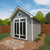 lifestyle gable style roof in a backyard with flowers plated around he shed lifestyle gable style roof in a backyard with flowers plated around he shed