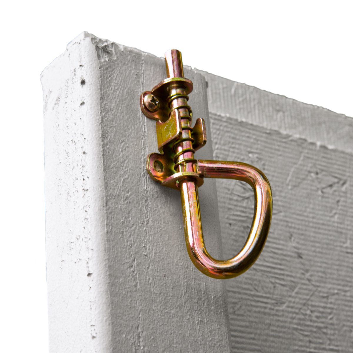 Close-up of a gold-colored metal gate latch attached to a wooden shed door.
