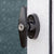 Close up of the metal handle and lock on the wooden shed